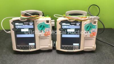 2 x Philips MRx Defibrillators Including ECG and Printer Options with 2 x Philips M3539A Power Adapters 2 x Paddle Lead, and 2 x 3 Lead ECG Leads (Both Power Up) *US00546549, US0054659*