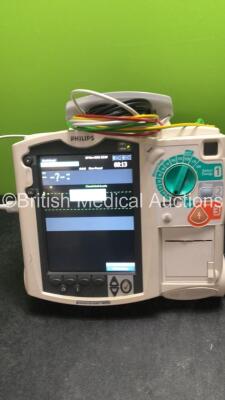 2 x Philips MRx Defibrillators Including ECG and Printer Options with 2 x Philips M3539A Power Adapters 2 x Paddle Lead, and 2 x 3 Lead ECG Leads (Both Power Up) *US00546549, US0054659* - 3