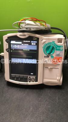 2 x Philips MRx Defibrillators Including ECG and Printer Options with 2 x Philips M3539A Power Adapters 2 x Paddle Lead, and 2 x 3 Lead ECG Leads (Both Power Up) *US00546541, US00546547* - 2