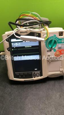 2 x Philips MRx Defibrillators Including ECG and Printer Options with 2 x Philips M3539A Power Adapters 2 x Paddle Lead, and 2 x 3 Lead ECG Leads (Both Power Up) *US00546541, US00546547* - 3