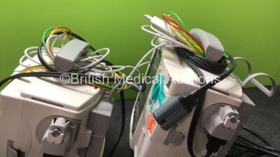 2 x Philips MRx Defibrillators Including ECG and Printer Options with 2 x Philips M3539A Power Adapters 2 x Paddle Lead, and 2 x 3 Lead ECG Leads (Both Power Up) *US00546541, US00546547* - 4