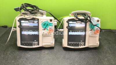 2 x Philips MRx Defibrillators Including ECG and Printer Options with 2 x Philips M3539A Power Adapters 2 x Paddle Lead, and 2 x 3 Lead ECG Leads (Both Power Up) *US00546550, US00546545*