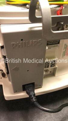 2 x Philips MRx Defibrillators Including ECG and Printer Options with 2 x Philips M3539A Power Adapters 2 x Paddle Lead, and 2 x 3 Lead ECG Leads (Both Power Up) *US00546550, US00546545* - 10