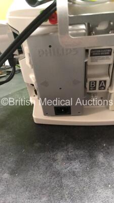 2 x Philips MRx Defibrillators Including Pacer,ECG and Printer Options with 2 x Philips M3539A Power Adapters, 2 x Philips M3538A Batteries, 2 x Paddle Lead, 2 x Philips M3725A Test Loads and 2 x 3 Lead ECG Leads (Both Power Up) *US00585183, US00546520* - 11