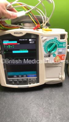 2 x Philips MRx Defibrillators Including Pacer, ECG SpO2 and Printer Options with 2 x Philips M3539A Power Adapters, 2 x Philips M3538A Batteries, 2 x Paddle Lead, and 2 x 3 Lead ECG Leads (Both Power Up) *US00539106, US00546526* - 2