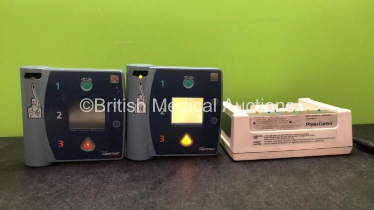 Mixed Lot Including 2 x Laerdal Heartstart FR2 Defibrillators (1 No Power, 1 Powers Up with Blank Display- Batteries Not Included) 1 x Physio Control Lifepak 5 Battery Charger (Powers Up)