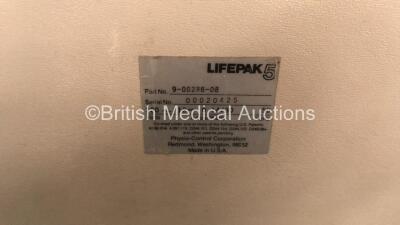 Mixed Lot Including 2 x Laerdal Heartstart FR2 Defibrillators (1 No Power, 1 Powers Up with Blank Display- Batteries Not Included) 1 x Physio Control Lifepak 5 Battery Charger (Powers Up) - 6