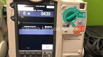 2 x Philips MRx Defibrillators Including Pacer, ECG and Printer Options with 2 x Philips M3539A Power Adapters and 2 x Philips M3538A Batteries, 2 x Paddle Lead, 2 x Philips M3725A Test Loads and 1 x 3 Lead ECG Lead (Both Power Up 1 with Device Error-See - 3