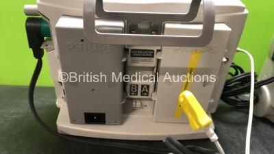 2 x Philips MRx Defibrillators Including Pacer, ECG and Printer Options with 2 x Philips M3539A Power Adapters and 2 x Philips M3538A Batteries, 2 x Paddle Lead, 2 x Philips M3725A Test Loads and 1 x 3 Lead ECG Lead (Both Power Up 1 with Device Error-See - 7