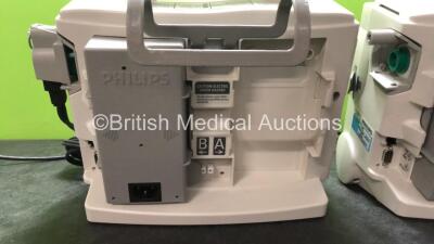 2 x Philips MRx Defibrillators Including Pacer, ECG and Printer Options with 2 x Philips M3539A Power Adapters, 1 x Paddle Lead, 1 x Philips M3725A Test Load (Both Power Up) - 5