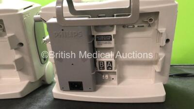 2 x Philips MRx Defibrillators Including Pacer, ECG and Printer Options with 2 x Philips M3539A Power Adapters, 1 x Paddle Lead, 1 x Philips M3725A Test Load (Both Power Up) - 6