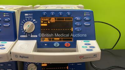 Job Lot Including 3 x Agilent Heartstream XL Smart Biphasic Defibrillators with Pacer, ECG and Printer Options, 3 x 3 Lead ECG Leads, 3 x Paddle Leads, 3 x Test Loads and 3 x Batteries and 1 x Philips Heartstart XL Smart Biphasic Defibrillator with Pacer, - 2