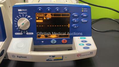 Job Lot Including 3 x Agilent Heartstream XL Smart Biphasic Defibrillators with Pacer, ECG and Printer Options, 3 x 3 Lead ECG Leads, 3 x Paddle Leads, 3 x Test Loads and 3 x Batteries and 1 x Philips Heartstart XL Smart Biphasic Defibrillator with Pacer, - 8