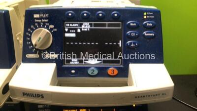 4 x Philips Heartstart XL Smart Biphasic Defibrillators with ECG and Printer Options, 4 x Test Loads, 4 x Paddle Leads, 4 x 3 Lead ECG Leads and 4 x Batteries (3 x Power Up) *US00108136 / US00448302 / US00448301 / US00122133* - 2