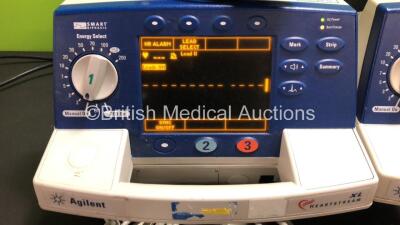 4 x Agilent Heartstream XL Smart Biphasic Defibrillators with ECG and Printer Options, 4 x Test Loads, 4 x Paddle Leads, 4 x 3 Lead ECG Leads and 4 x Batteries (All Powewr Up) *US00103775 - US00110040 - US00110041 - US00110042* - 5