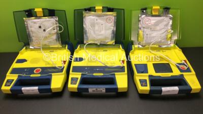 2 x Cardiac Science Powerheart AED G3 and 1 x AED G3 Pro Automated External Defibrillators with 1 x Battery (All Power Up)