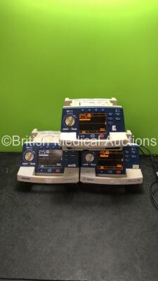 Job Lot Including 2 x Agilent Heartstream XL Defibrillators Including ECG and Printer Options (Both Power Up, 1 with Cracked Dial-See Photo) 1 x Philips Heartstsrt XL Defibrillator Includiung ECG and Printer Options (Powers Up)