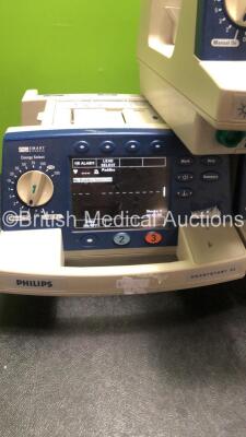 Job Lot Including 2 x Agilent Heartstream XL Defibrillators Including ECG and Printer Options (Both Power Up, 1 with Cracked Dial-See Photo) 1 x Philips Heartstsrt XL Defibrillator Includiung ECG and Printer Options (Powers Up) - 4