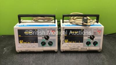 2 x Zoll M Series Biphasic Defibrillators Including Pacer ECG and Printer Options with 2 x Batteries and 2 x Patch Cables (Both Power Up) *T05F71997, T04D57716*