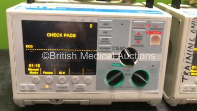 2 x Zoll M Series Biphasic Defibrillators Including Pacer ECG and Printer Options with 2 x Batteries and 2 x Patch Cables (Both Power Up) *T05F71997, T04D57716* - 2