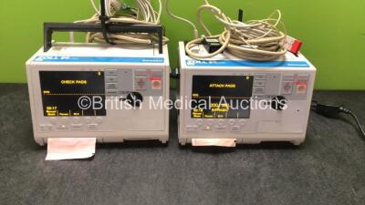 2 x Zoll M Series Biphasic Defibrillators Including ECG and Printer Options with 2 x Batteries, 2 x Patch Cables and 2 x 3 Lead ECG Leads (Both Power Up) *SN TZ7I94297, T06K85376*