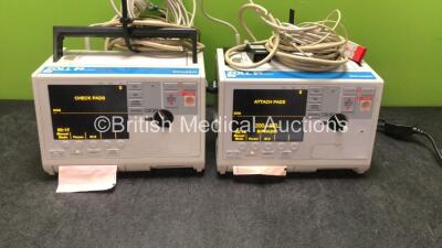 2 x Zoll M Series Biphasic Defibrillators Including ECG and Printer Options with 2 x Batteries, 2 x Patch Cables and 2 x 3 Lead ECG Leads (Both Power Up) *SN TZ7I94297, T06K85376* - 2