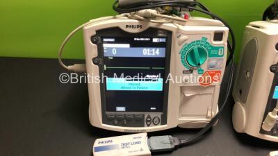 2 x Philips MRx Defibrillators Including ECG and Printer Options with 2 x Philips M3539A Power Adapters and 2 x Philips M3538A Batteries 2 x Paddle Lead, 2 x Philips M3725A Test Loads and 2 x 3 Lead ECG Leads (Both Power Up) *US00546551 - US00546543* - 3