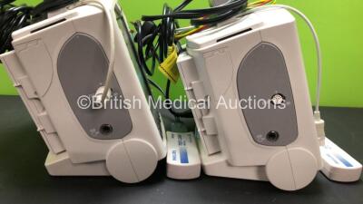 2 x Philips MRx Defibrillators Including ECG and Printer Options with 2 x Philips M3539A Power Adapters and 2 x Philips M3538A Batteries 2 x Paddle Lead, 2 x Philips M3725A Test Loads and 2 x 3 Lead ECG Leads (Both Power Up) *US00546551 - US00546543* - 4