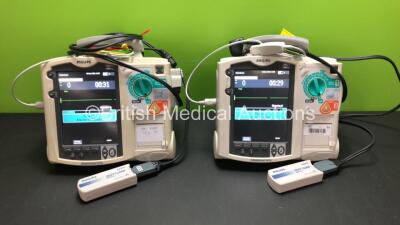 2 x Philips MRx Defibrillators Including ECG and Printer Options with 2 x Philips M3539A Power Adapters and 2 x Philips M3538A Batteries 2 x Paddle Lead, 2 x Philips M3725A Test Loads and 2 x 3 Lead ECG Leads (Both Power Up) *US00546533 - US00546532*