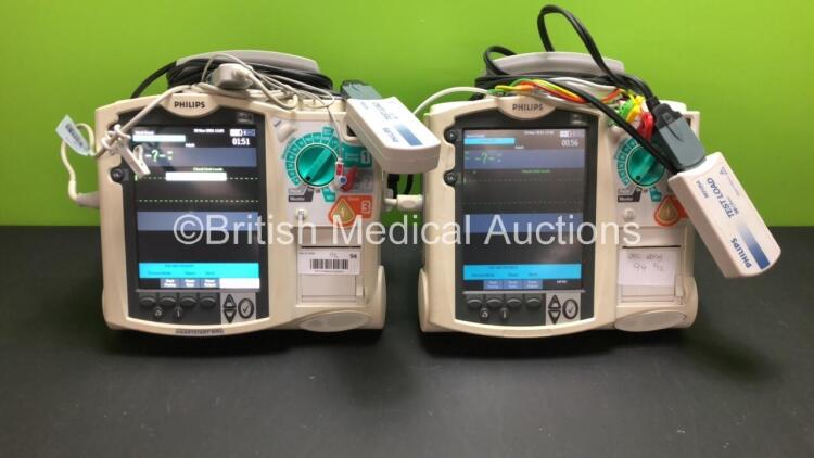 2 x Philips MRx Defibrillators Including Pacer, ECG and Printer Options with 2 x Philips M3539A Power Adapters and 2 x Philips M3538A Batteries 2 x Paddle Lead, 2 x Philips M3725A Test Loads and 2 x 3 Lead ECG Leads (Both Power Up) *US00546528 - US0031518