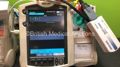 2 x Philips MRx Defibrillators Including Pacer, ECG and Printer Options with 2 x Philips M3539A Power Adapters and 2 x Philips M3538A Batteries 2 x Paddle Lead, 2 x Philips M3725A Test Loads and 2 x 3 Lead ECG Leads (Both Power Up) *US00546528 - US0031518 - 2