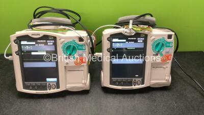 2 x Philips MRx Defibrillators Including ECG and Printer Options with 2 x Philips M3539A Power Adapters 2 x Paddle Lead, and 2 x 3 Lead ECG Leads (Both Power Up) *US00546536, US005747548*