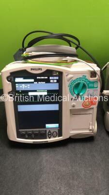 2 x Philips MRx Defibrillators Including ECG and Printer Options with 2 x Philips M3539A Power Adapters 2 x Paddle Lead, and 2 x 3 Lead ECG Leads (Both Power Up) *US00546536, US005747548* - 2