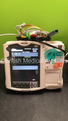 2 x Philips MRx Defibrillators Including ECG and Printer Options with 2 x Philips M3539A Power Adapters 2 x Paddle Lead, and 2 x 3 Lead ECG Leads (Both Power Up, 1 with Damaged Screen-See Photo) *US00546555, US00546538* - 3