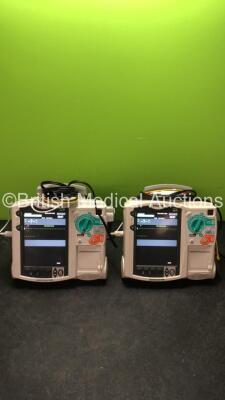 2 x Philips MRx Defibrillators Including ECG and Printer Options with 2 x Philips M3539A Power Adapters 2 x Paddle Lead, and 2 x 3 Lead ECG Leads (Both Power Up) *US00546535, US00546531*