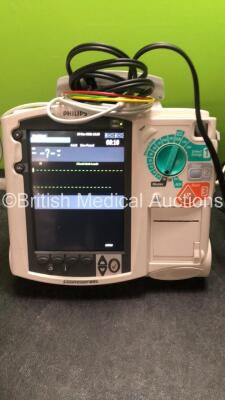 2 x Philips MRx Defibrillators Including ECG and Printer Options with 2 x Philips M3539A Power Adapters 2 x Paddle Lead, and 2 x 3 Lead ECG Leads (Both Power Up) *US00546535, US00546531* - 2