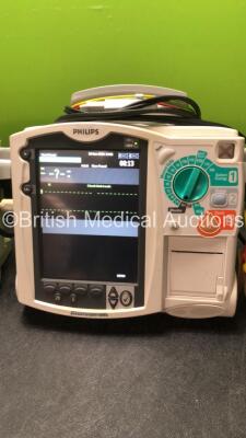 2 x Philips MRx Defibrillators Including ECG and Printer Options with 2 x Philips M3539A Power Adapters 2 x Paddle Lead, and 2 x 3 Lead ECG Leads (Both Power Up) *US00546535, US00546531* - 3