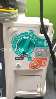 2 x Philips MRx Defibrillators Including ECG and Printer Options with 2 x Philips M3539A Power Adapters 2 x Paddle Lead, and 2 x 3 Lead ECG Leads (Both Power Up) *US00546535, US00546531* - 4