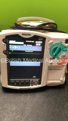 2 x Philips MRx Defibrillators Including ECG and Printer Options with 2 x Philips M3539A Power Adapters 2 x Paddle Lead, and 2 x 3 Lead ECG Leads (Both Power Up) *US00546535, US00546531* - 6