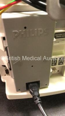 2 x Philips MRx Defibrillators Including ECG and Printer Options with 2 x Philips M3539A Power Adapters 2 x Paddle Lead, and 2 x 3 Lead ECG Leads (Both Power Up) *US00546535, US00546531* - 10