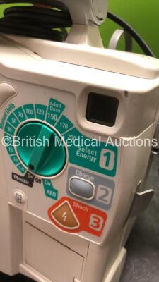 2 x Philips MRx Defibrillators Including ECG and Printer Options with 2 x Philips M3539A Power Adapters 2 x Paddle Lead, and 2 x 3 Lead ECG Leads (Both Power Up) *US00565620, US003151575* - 4