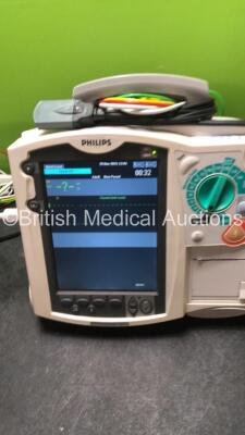 2 x Philips MRx Defibrillators Including ECG and Printer Options with 2 x Philips M3539A Power Adapters 2 x Paddle Lead, and 2 x 3 Lead ECG Leads (Both Power Up) *US00565620, US003151575* - 8