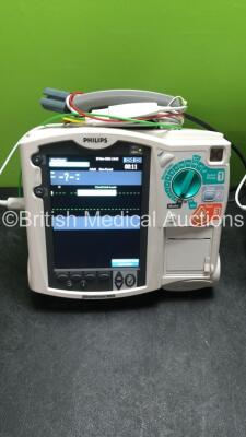 2 x Philips MRx Defibrillators Including ECG and Printer Options with 2 x Philips M3539A Power Adapters 2 x Paddle Lead, and 2 x 3 Lead ECG Leads (Both Power Up) *US00546452, US00546540* - 2