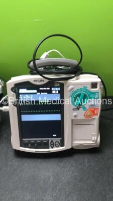 2 x Philips MRx Defibrillators Including ECG and Printer Options with 2 x Philips M3539A Power Adapters 2 x Paddle Lead, and 2 x 3 Lead ECG Leads (Both Power Up) *US00546452, US00546540* - 3