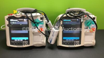 2 x Philips MRx Defibrillators Including Pacer, ECG and Printer Options with 2 x Philips M3539A Power Adapters and 2 x Philips M3538A Batteries 2 x Paddle Lead, 2 x Philips M3725A Test Loads and 2 x 3 Lead ECG Leads (Both Power Up) *US00546523 - US0032222