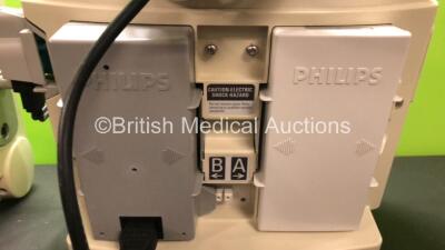 2 x Philips MRx Defibrillators Including Pacer, ECG and Printer Options with 2 x Philips M3539A Power Adapters and 2 x Philips M3538A Batteries 2 x Paddle Lead, 2 x Philips M3725A Test Loads and 2 x 3 Lead ECG Leads (Both Power Up) *US00546523 - US0032222 - 5