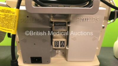 2 x Philips MRx Defibrillators Including Pacer, ECG and Printer Options with 2 x Philips M3539A Power Adapters and 2 x Philips M3538A Batteries 2 x Paddle Lead, 2 x Philips M3725A Test Loads and 2 x 3 Lead ECG Leads (Both Power Up) *US00546523 - US0032222 - 6