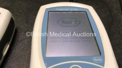 3 x Roche CoaguChek XS Plus Blood Monitoring Units with 1 x AC Power Supply (All Power Up, 2 with System Error and 1 with Faulty Screen and Missing Battery-See Photos) *RI* - 4
