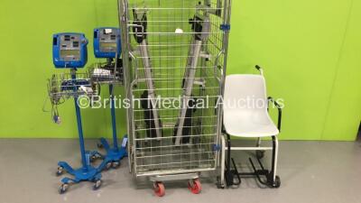 2 x GE Dinamap Pro 400V2 Vital Signs Monitors on Stands, 2 x Alaris Charging Stations (Cage Not Included) and 1 x Marsden Weighing Scales