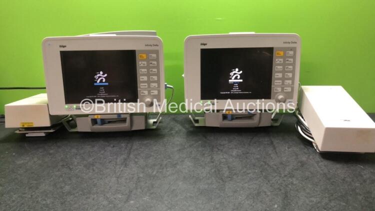 2 x Drager Infinity Delta Patient Monitors with HemoMed 1, Aux - Hemo 2 and 3, MultiMed and SpO2 Options *Mfd 2009 - 2009* with 2 x Drager Power Supplies and 2 x Docking Stations (Both Power Up) *SN 6000965469, 6000967467*